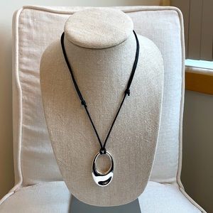 Adjustable pendant rope necklace.